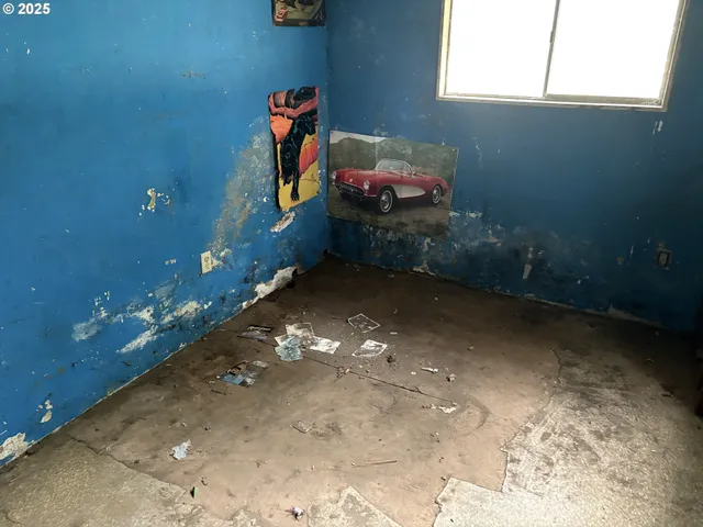 a bathroom with a granite countertop sink and a toilet