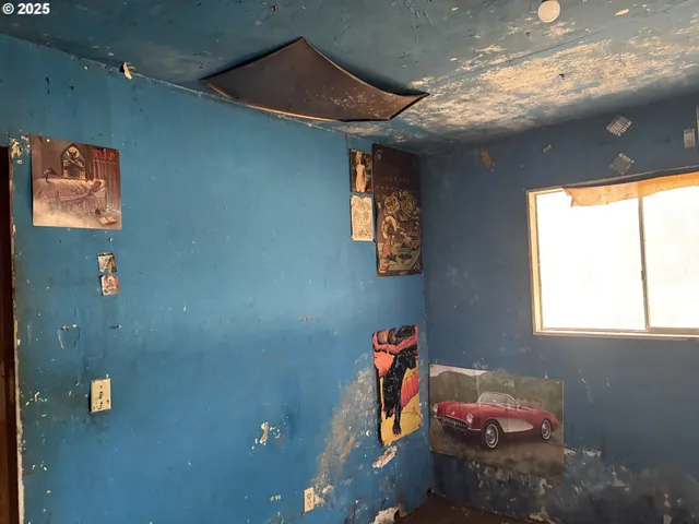 a kitchen with a stove a microwave and cabinets