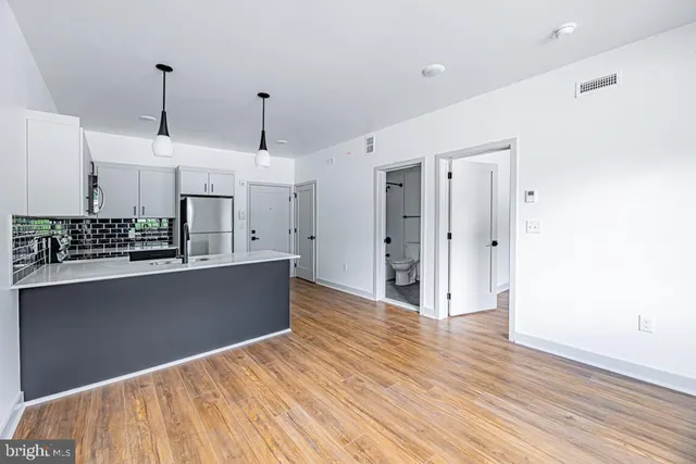 a view of a hallway with washer and dryer