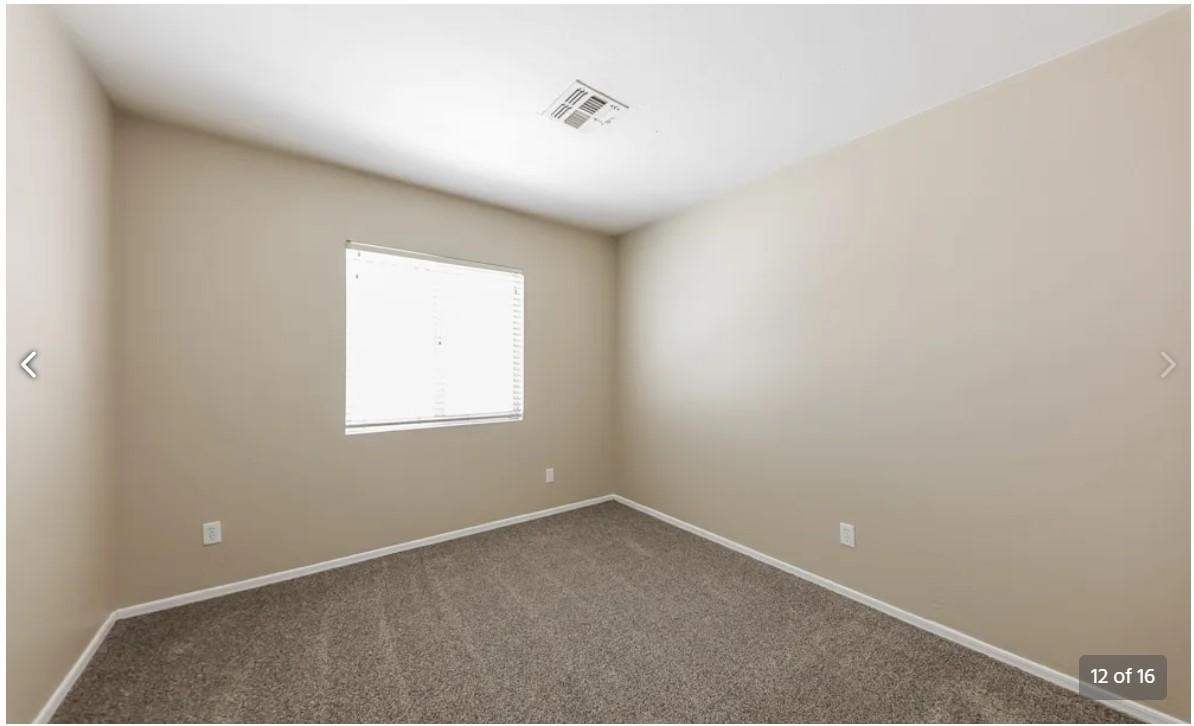 12563 West Charter Oak Road El Mirage, AZ 85335 - Photo 12 of 16 an empty room with a window