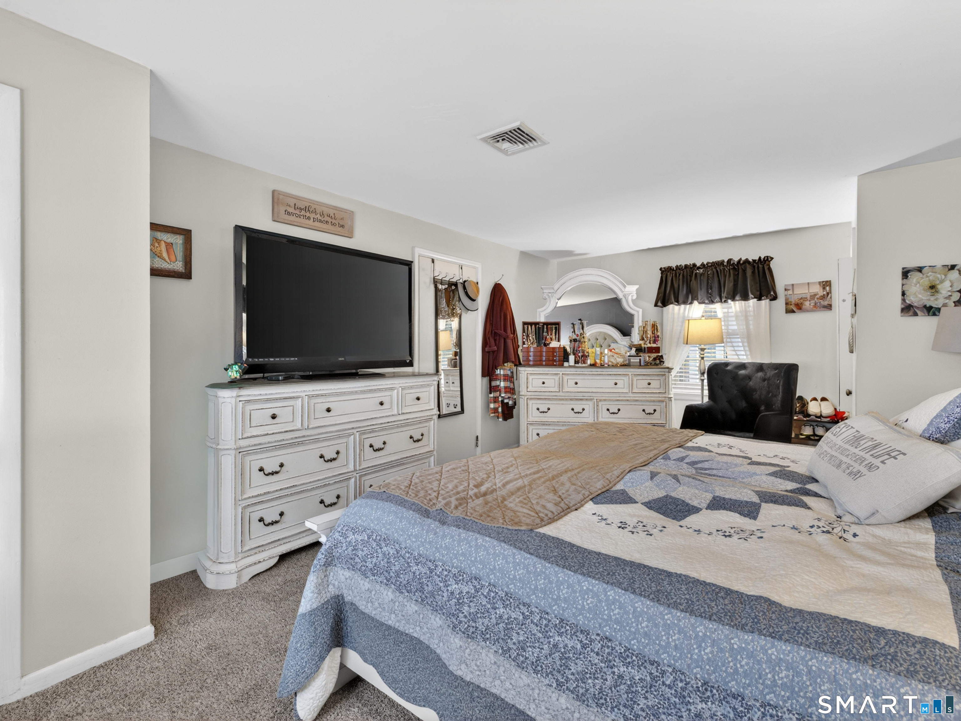 235 Scotland Road Norwich, CT 06360 - Photo 17 of 31 a bedroom with a bed and a flat screen tv