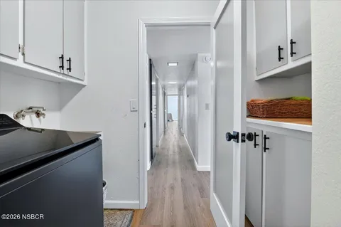 a view of a kitchen from the hallway