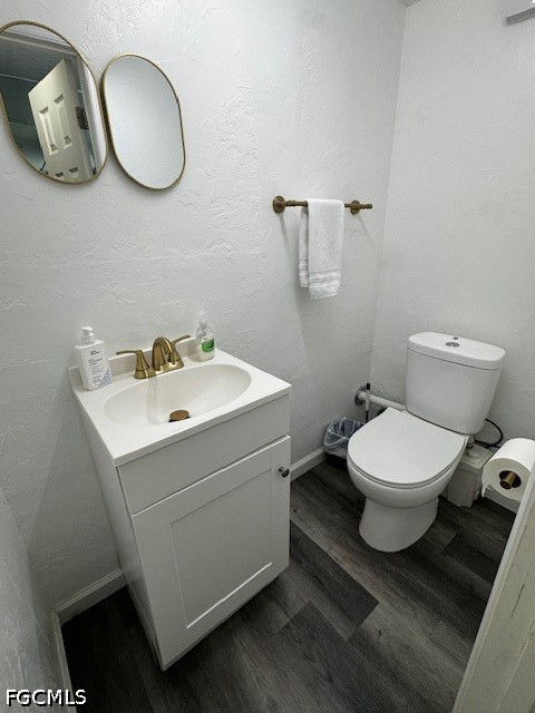 8409 Tahiti Road, Unit A Fort Myers, FL 33967 - Photo 19 of 23 a bathroom with a toilet a sink and mirror