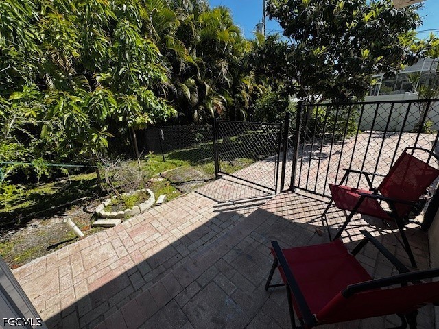 8409 Tahiti Road, Unit A Fort Myers, FL 33967 - Photo 23 of 23 a view of a chairs and table on the wooden floor