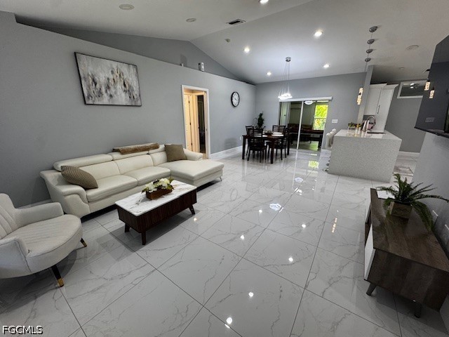 8409 Tahiti Road, Unit A Fort Myers, FL 33967 - Photo 6 of 23 a living room with furniture and a gym