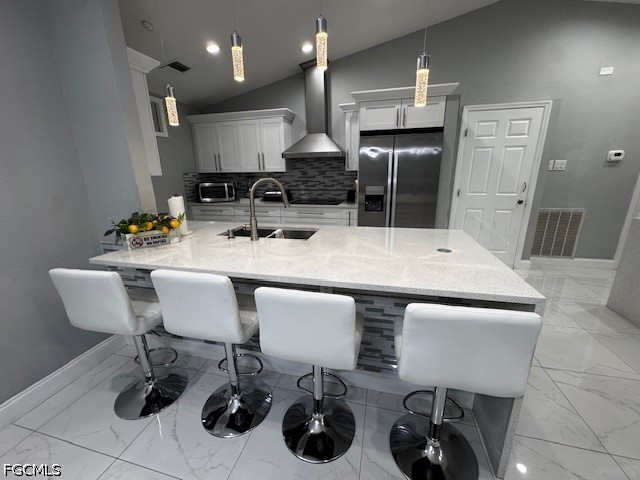8409 Tahiti Road, Unit A Fort Myers, FL 33967 - Photo 10 of 23 a kitchen with a table chairs sink and refrigerator