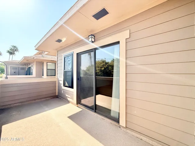 a view of a glass door of the house