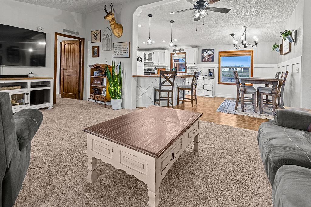 6181 Highway 394 Craig, CO 81625 - Photo 4 of 15 a living room with stainless steel appliances kitchen island granite countertop furniture and a kitchen view