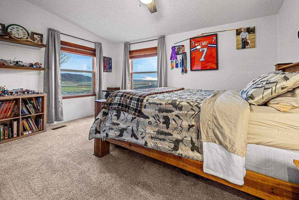 6181 Highway 394 Craig, CO 81625 - Photo 7 of 15 a bed sitting in a bedroom next to a window