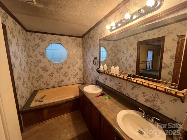 a bathroom with a granite countertop sink toilet and a mirror