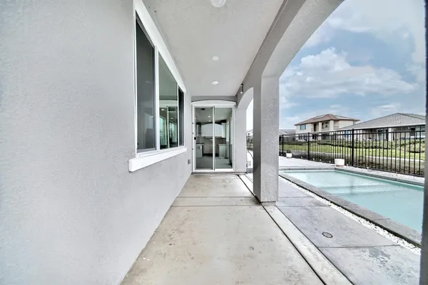 a view of swimming pool with outdoor seating