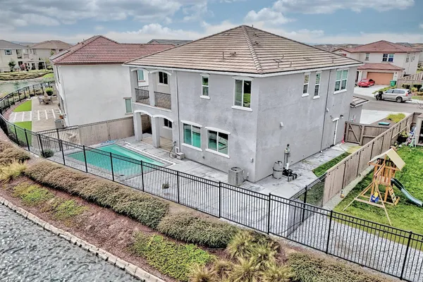 a view of a house with wooden deck