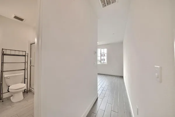 a view of a bathroom with toilet