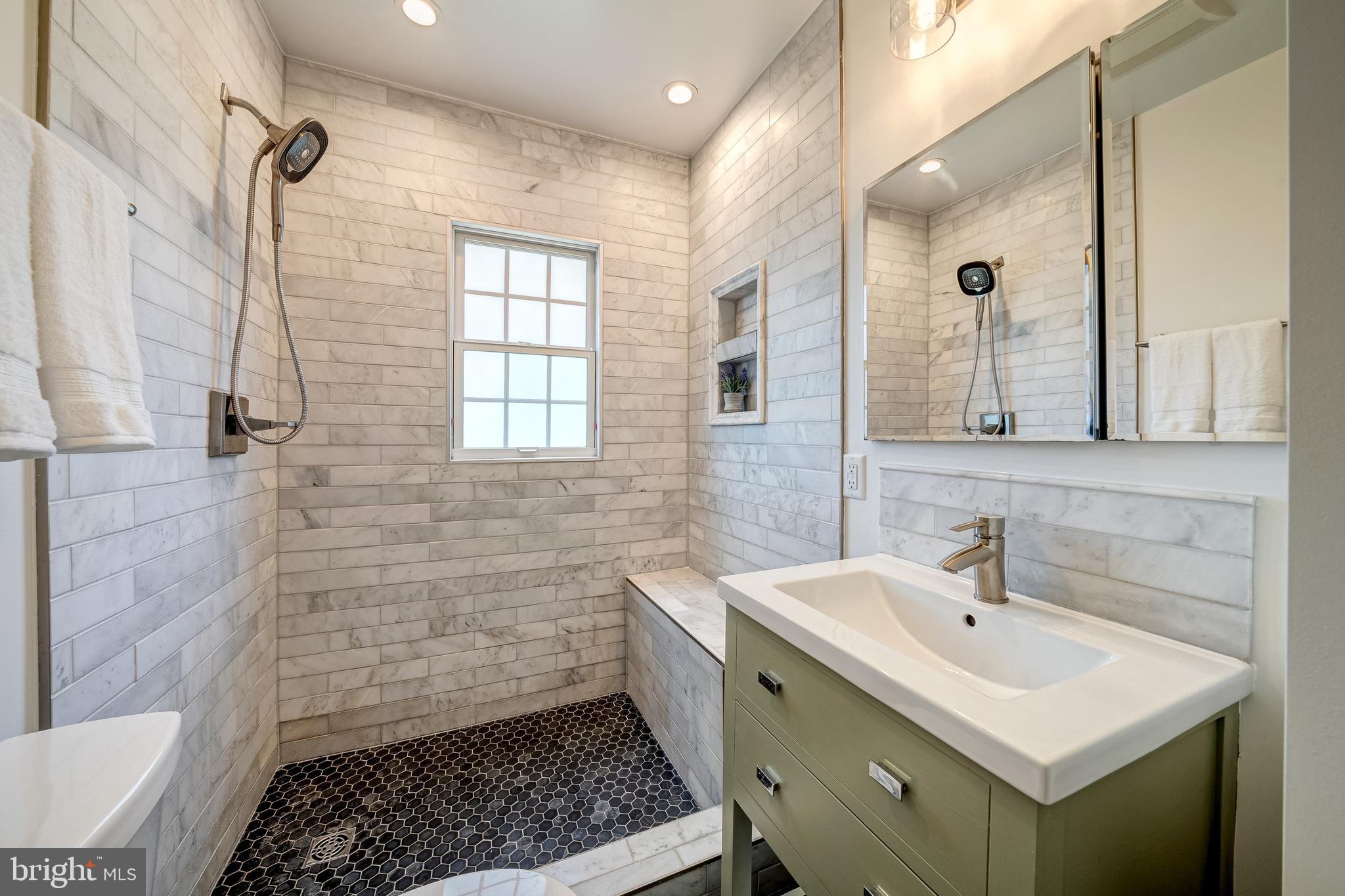 8436 Leaf Road Alexandria, VA 22309 - Photo 18 of 29 Main-level full bath with Carrera marble