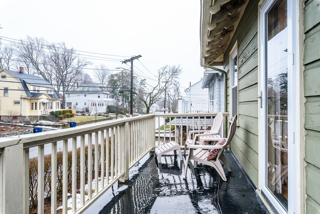 176 Manthorne Road, Unit 2 Boston, MA 02132 - Photo 16 of 16 a view of a balcony with an outdoor seating