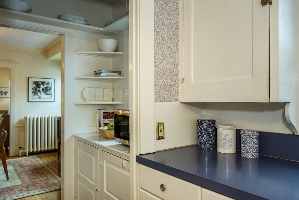 176 Manthorne Road, Unit 2 Boston, MA 02132 - Photo 6 of 16 a kitchen with a sink and cabinets
