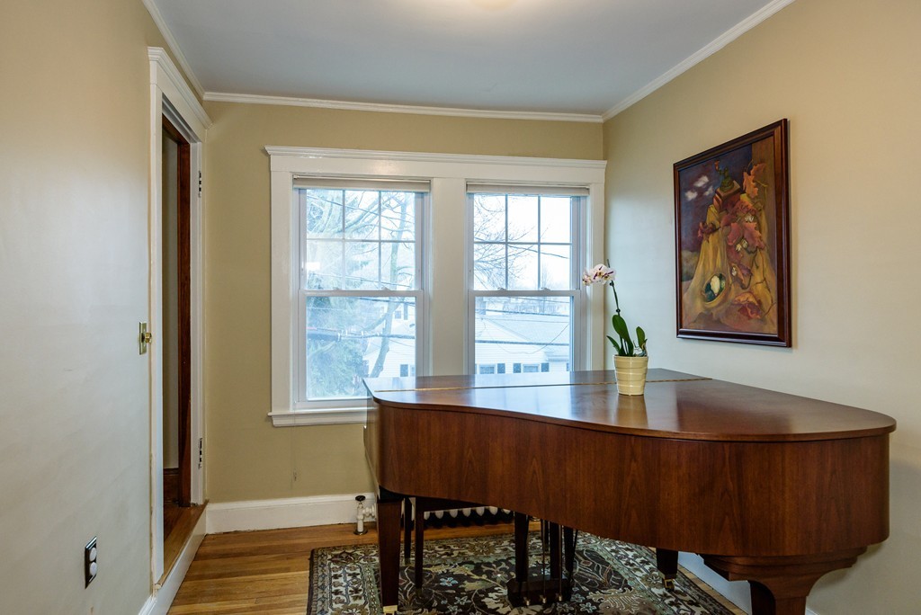 176 Manthorne Road, Unit 2 Boston, MA 02132 - Photo 8 of 16 a workspace with furniture and a window