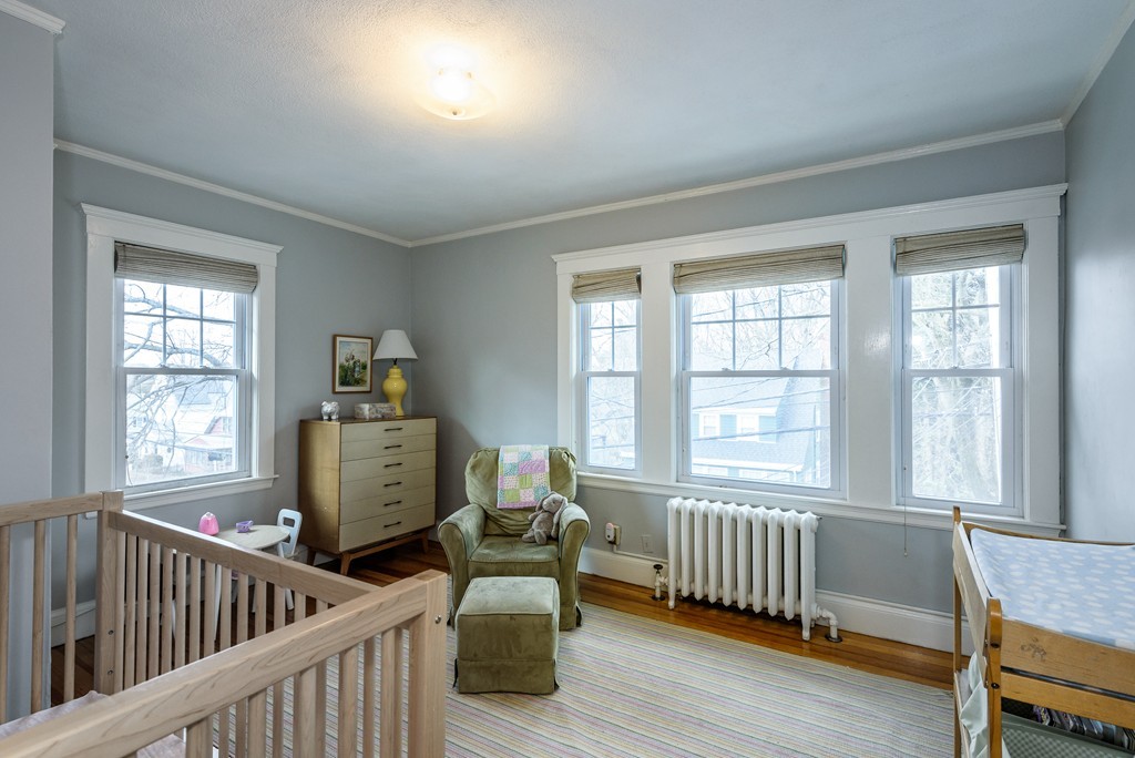 176 Manthorne Road, Unit 2 Boston, MA 02132 - Photo 10 of 16 a living room with furniture and two windows