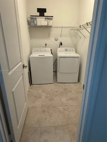 a bathroom with a sink vanity mirror and toilet