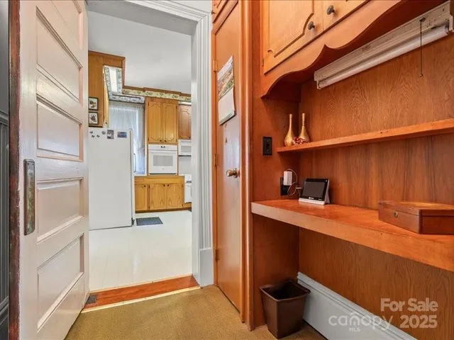 a kitchen with a sink cabinets and window