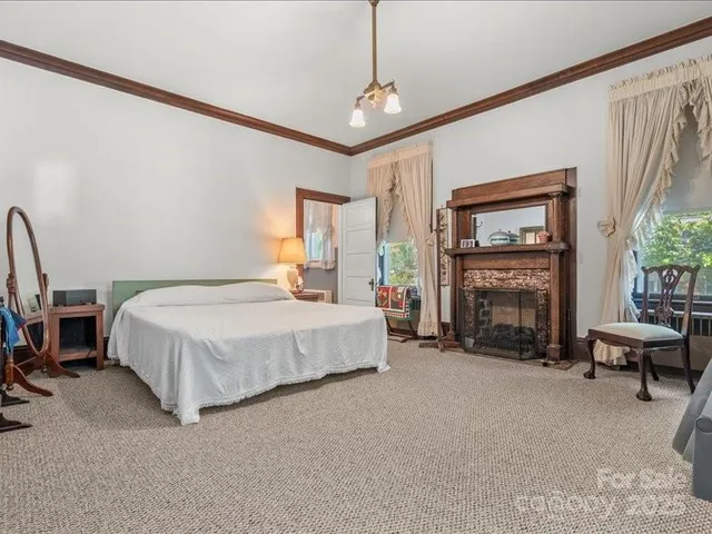 a bed room with a bed and a tv