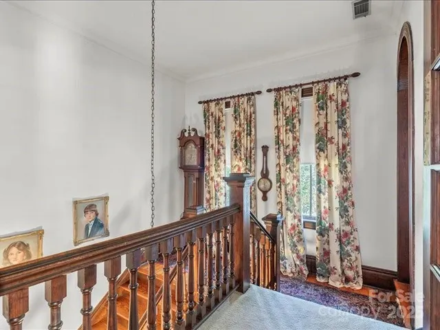 a view of entryway livingroom and hall with wooden floor