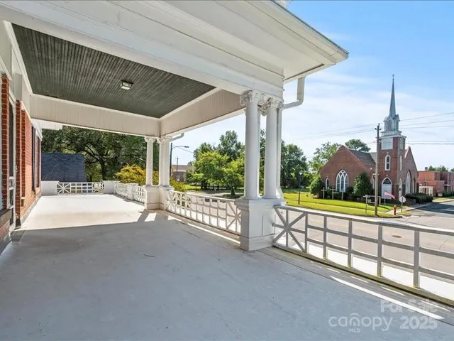a view of a house with a street