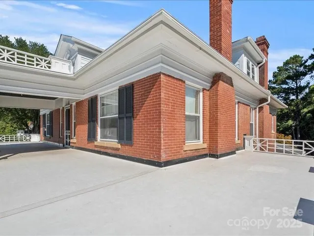 a view of a yard with a table and chairs