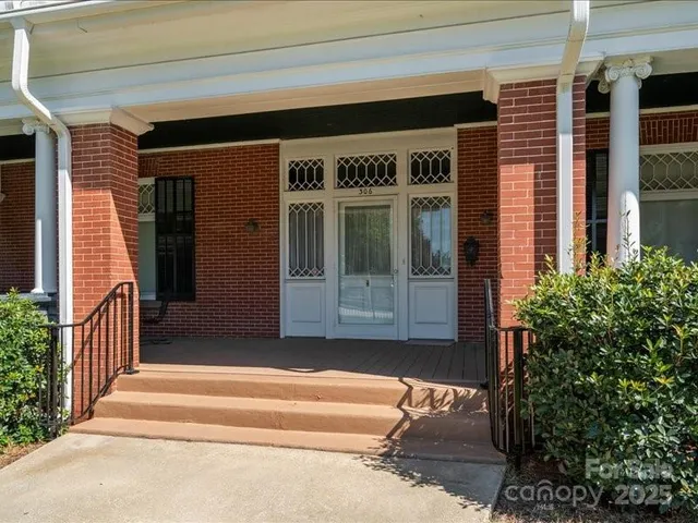 a living room with furniture rug and a table