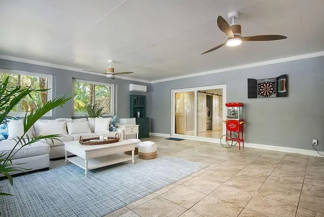 a living room with couch and a large window