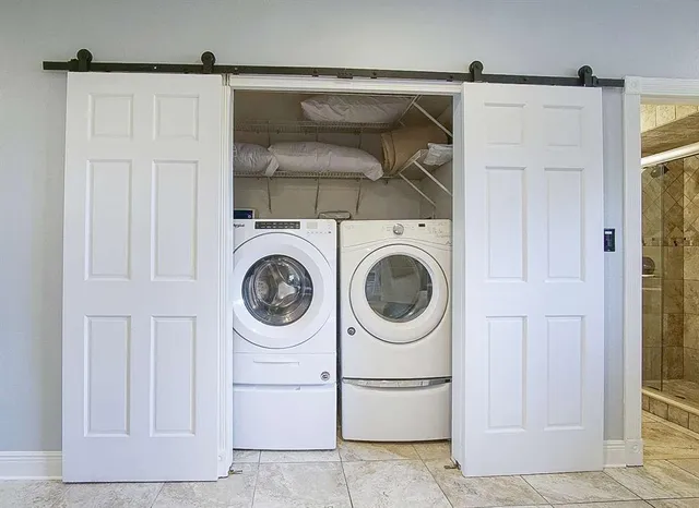 a utility room with dryer and washer