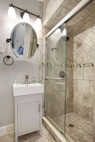 a bathroom with a sink and mirror