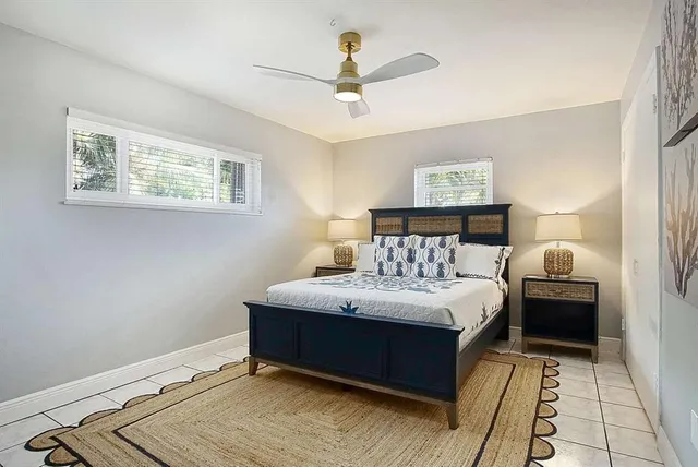 a bedroom with a bed and a table