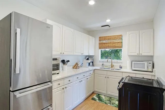 a bathroom with a toilet sink and shower