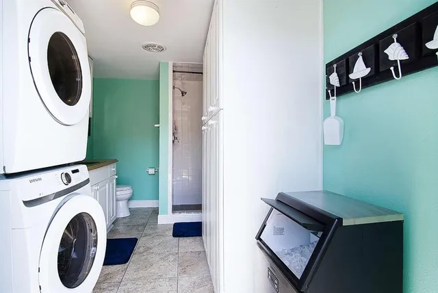 a kitchen with a stove and a microwave oven on the table