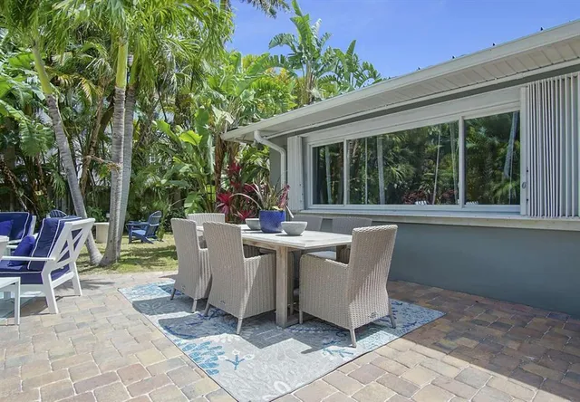 a view of a swimming pool with an outdoor space and seating area