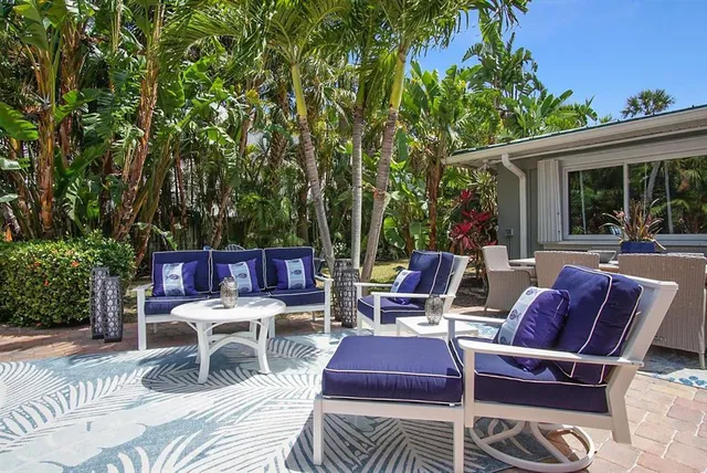 a view of a chairs and table in the patio
