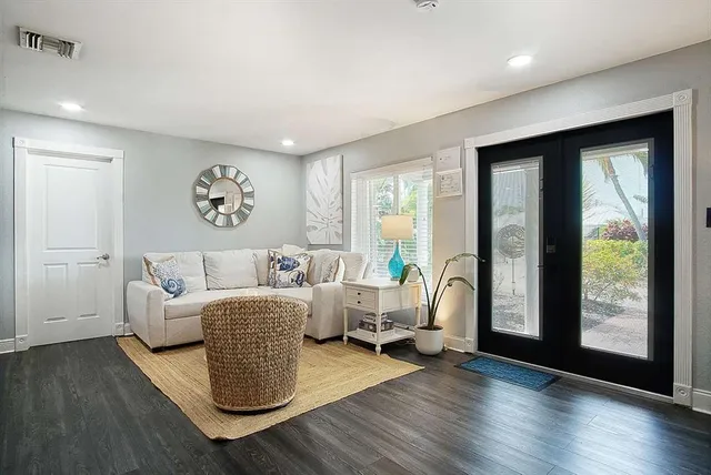 a living room with furniture and a large window