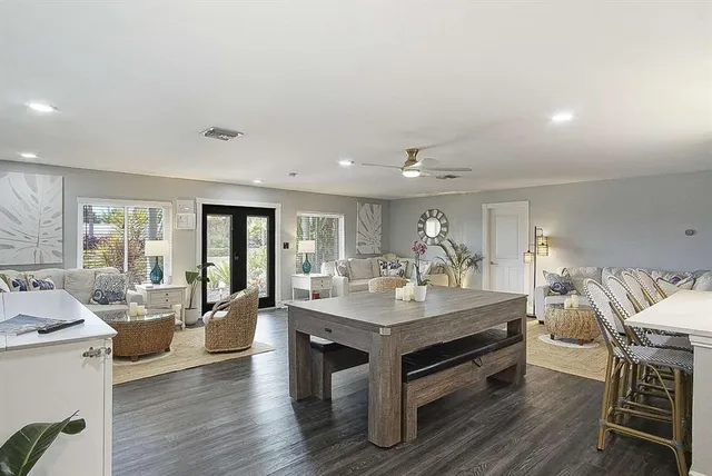 a view of living room filled with furniture and wooden floor