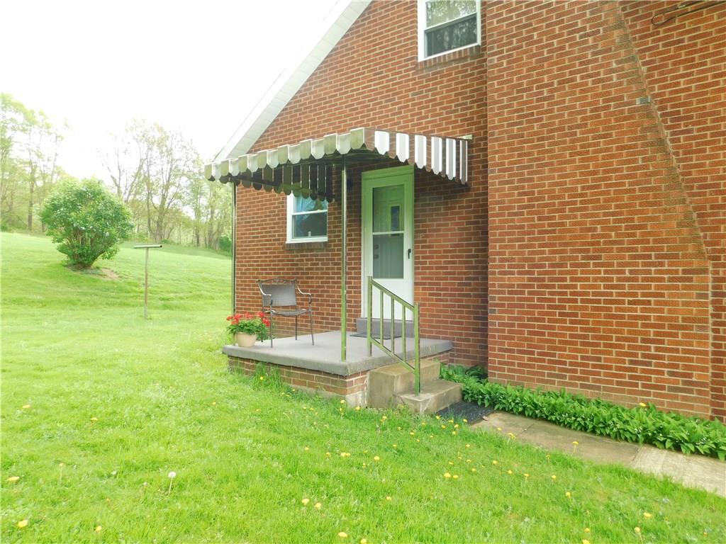 1086 White Cloud Road Apollo, PA 15613 - Photo 5 of 21 The covered side porch allows exit from the kitchen.