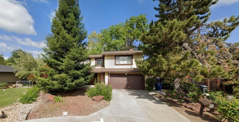 front view of a house with a garden
