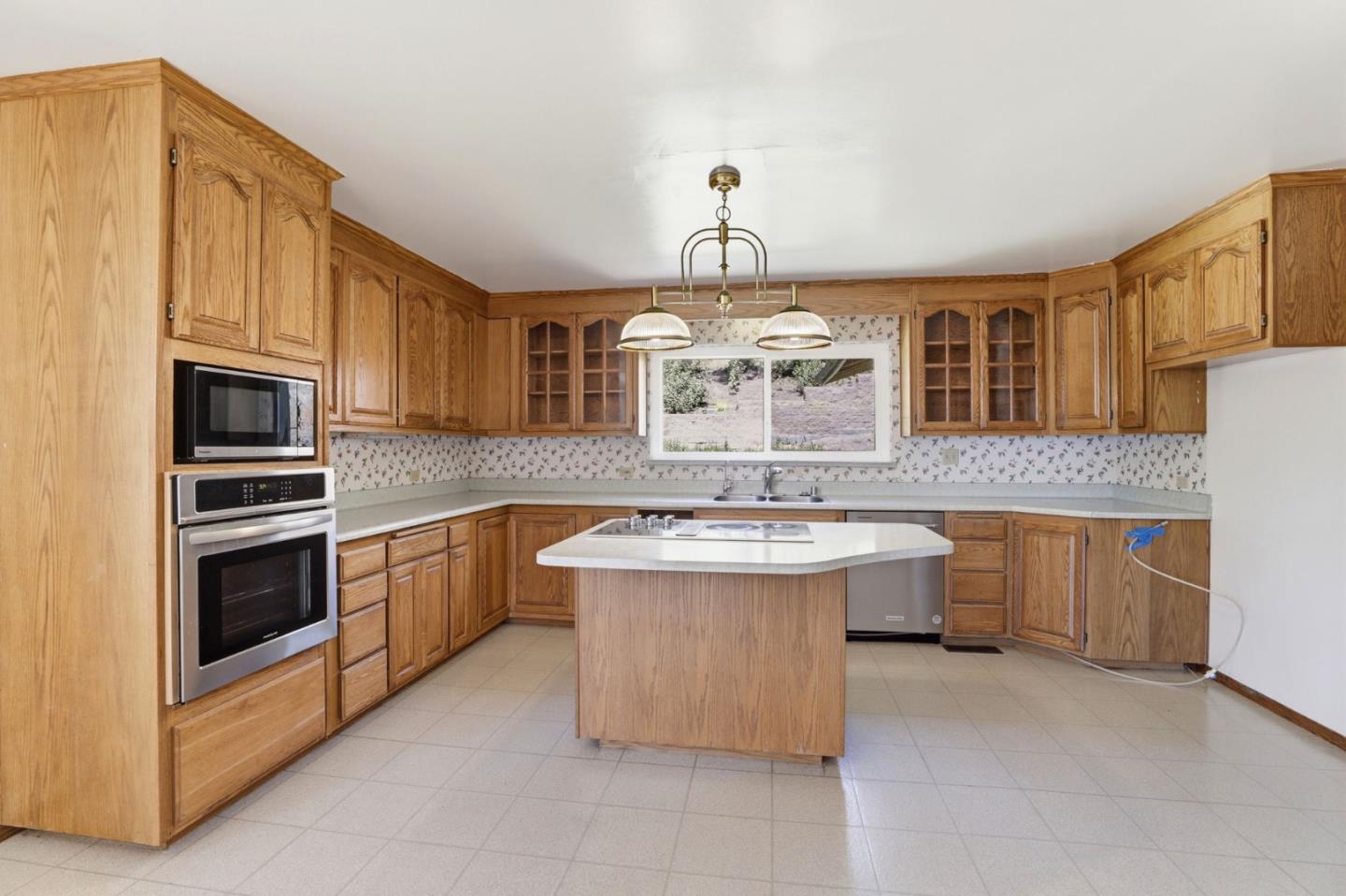 208 Mill Creek Road Fremont, CA 94539 - Photo 12 of 59 a kitchen with stainless steel appliances a sink stove and cabinets