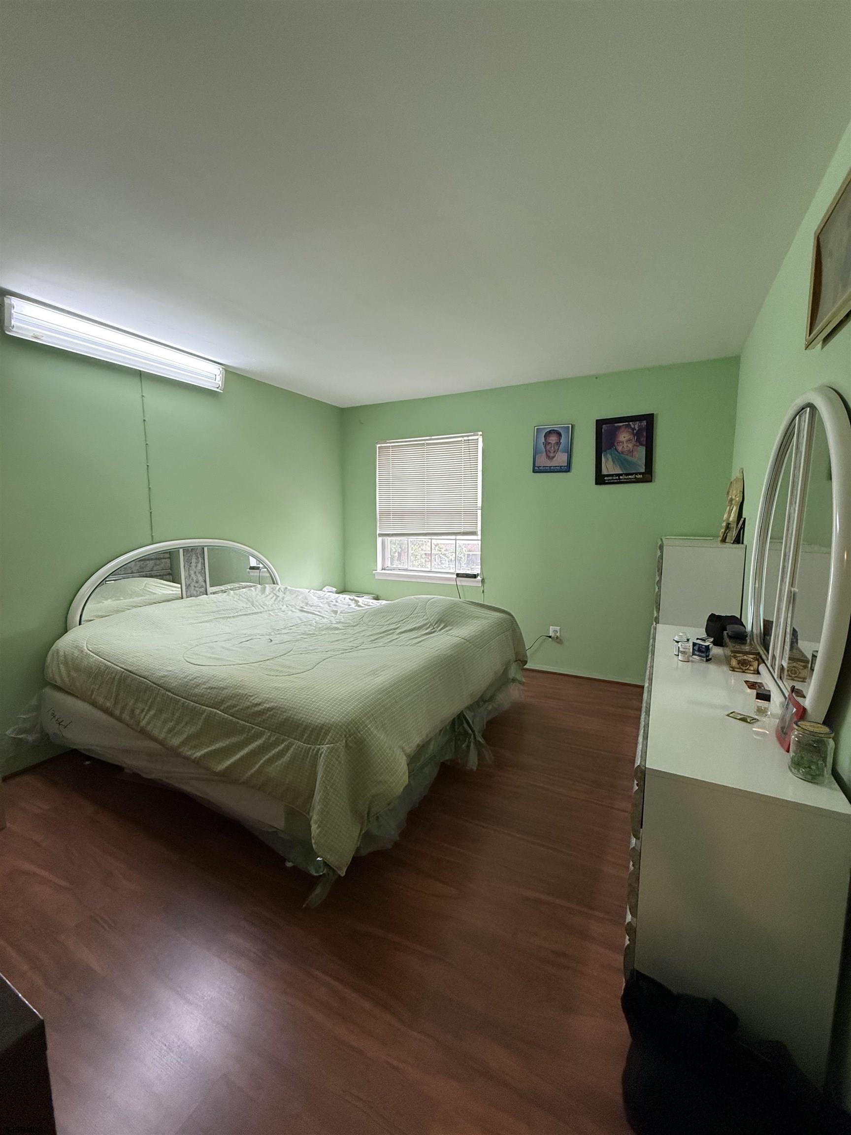 720 South New Road, Unit 5M Absecon, NJ 08201 - Photo 12 of 14 a bedroom with a bed and a desk