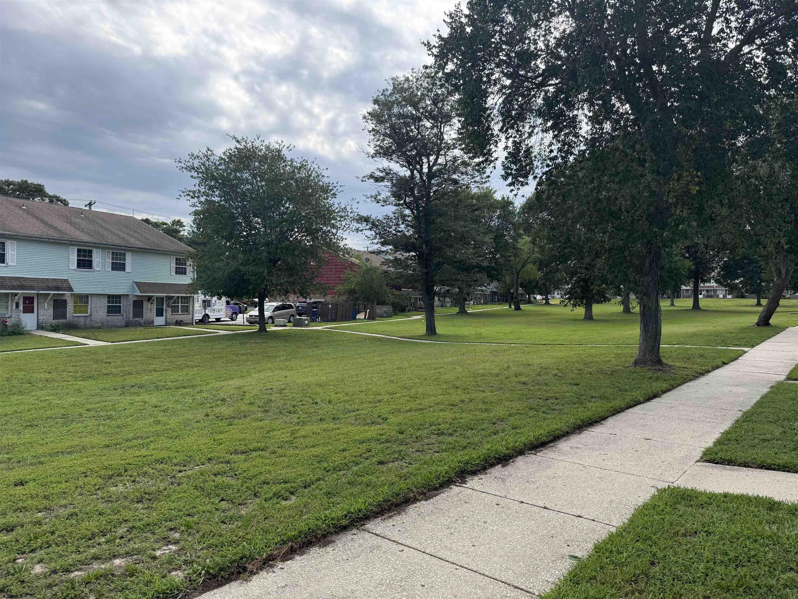 720 South New Road, Unit 5M Absecon, NJ 08201 - Photo 14 of 14 a view of building with green space