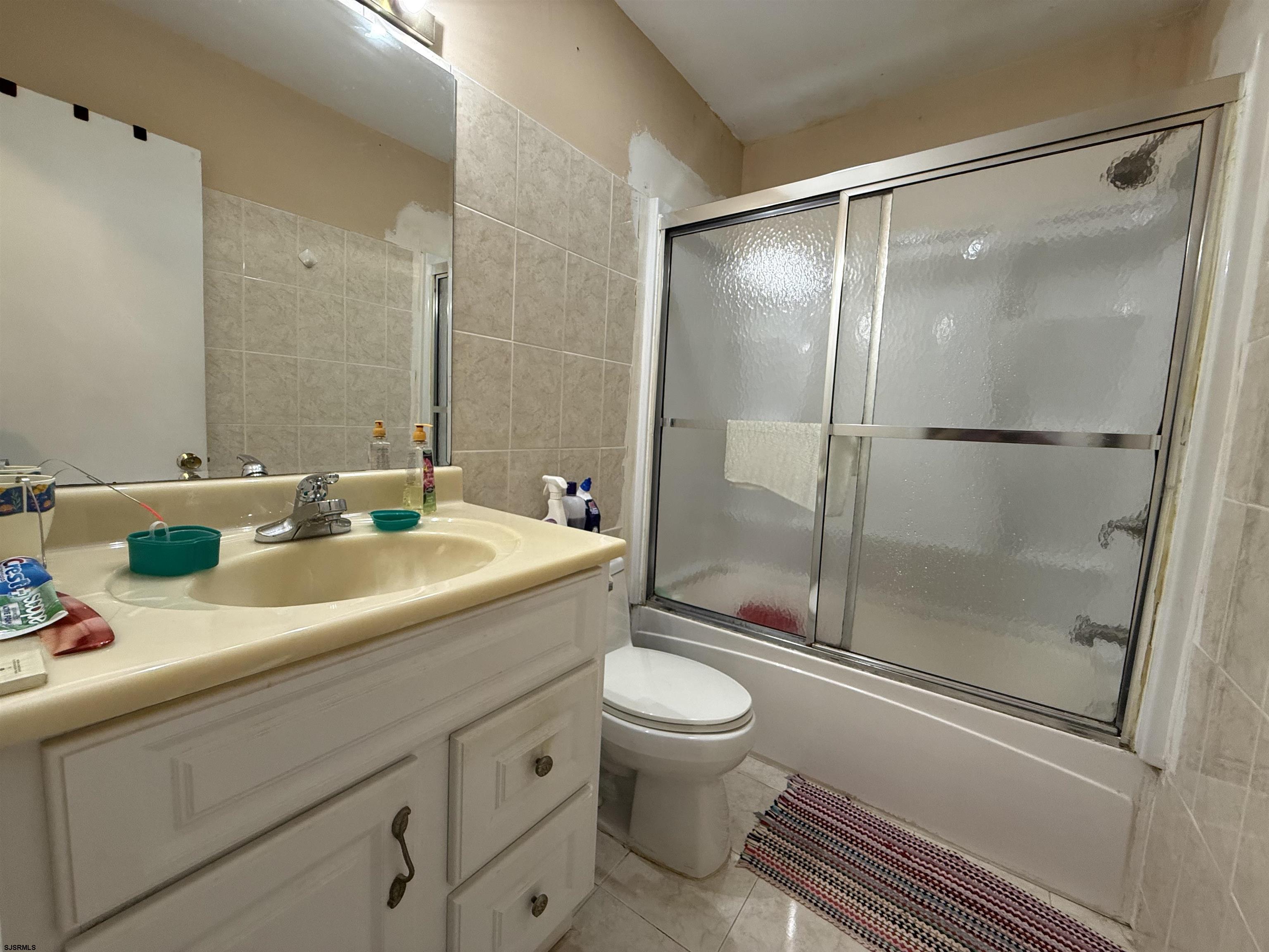 720 South New Road, Unit 5M Absecon, NJ 08201 - Photo 8 of 14 a bathroom with a sink a toilet and shower