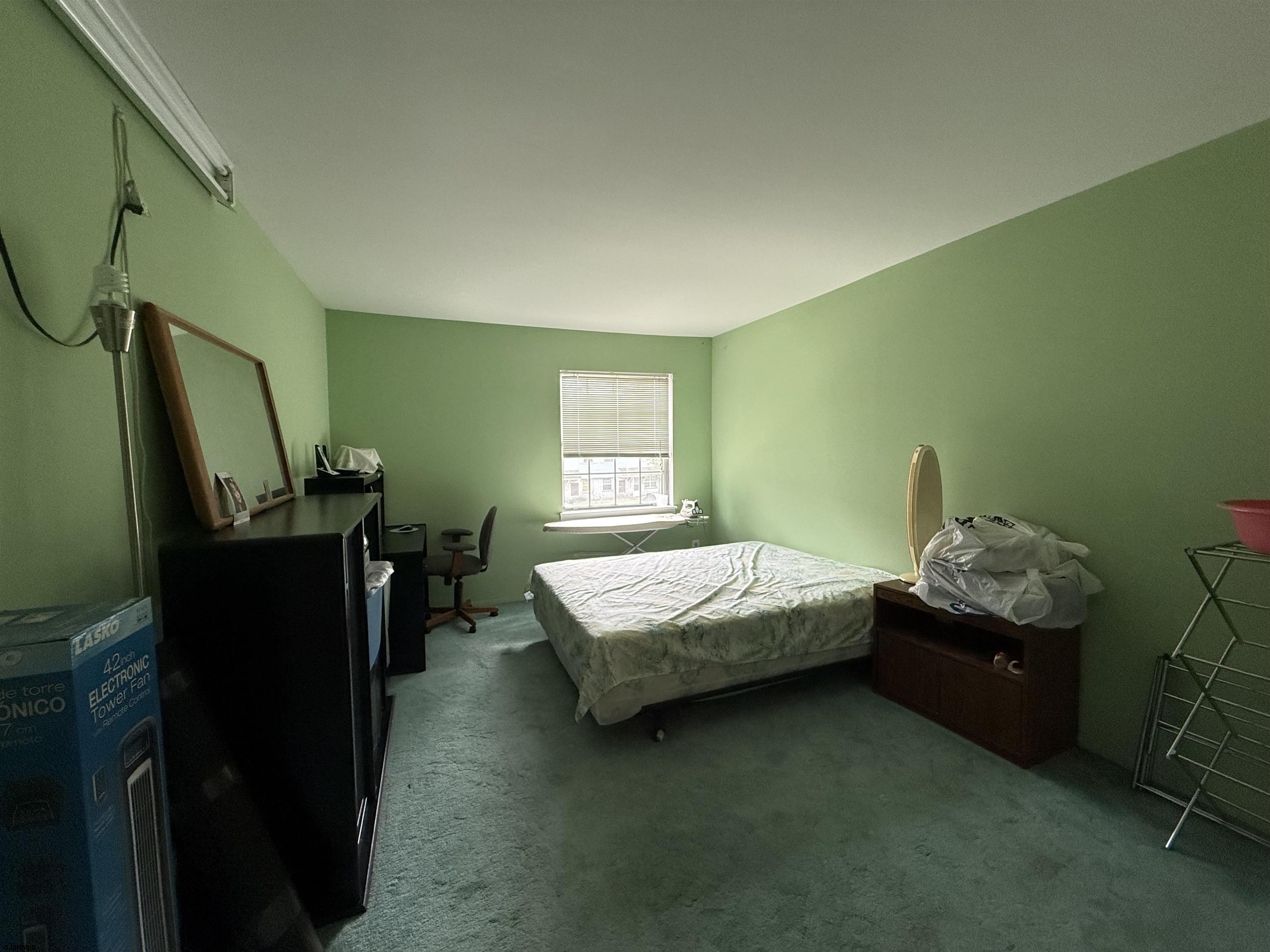 720 South New Road, Unit 5M Absecon, NJ 08201 - Photo 9 of 14 a bedroom with a bed and a window