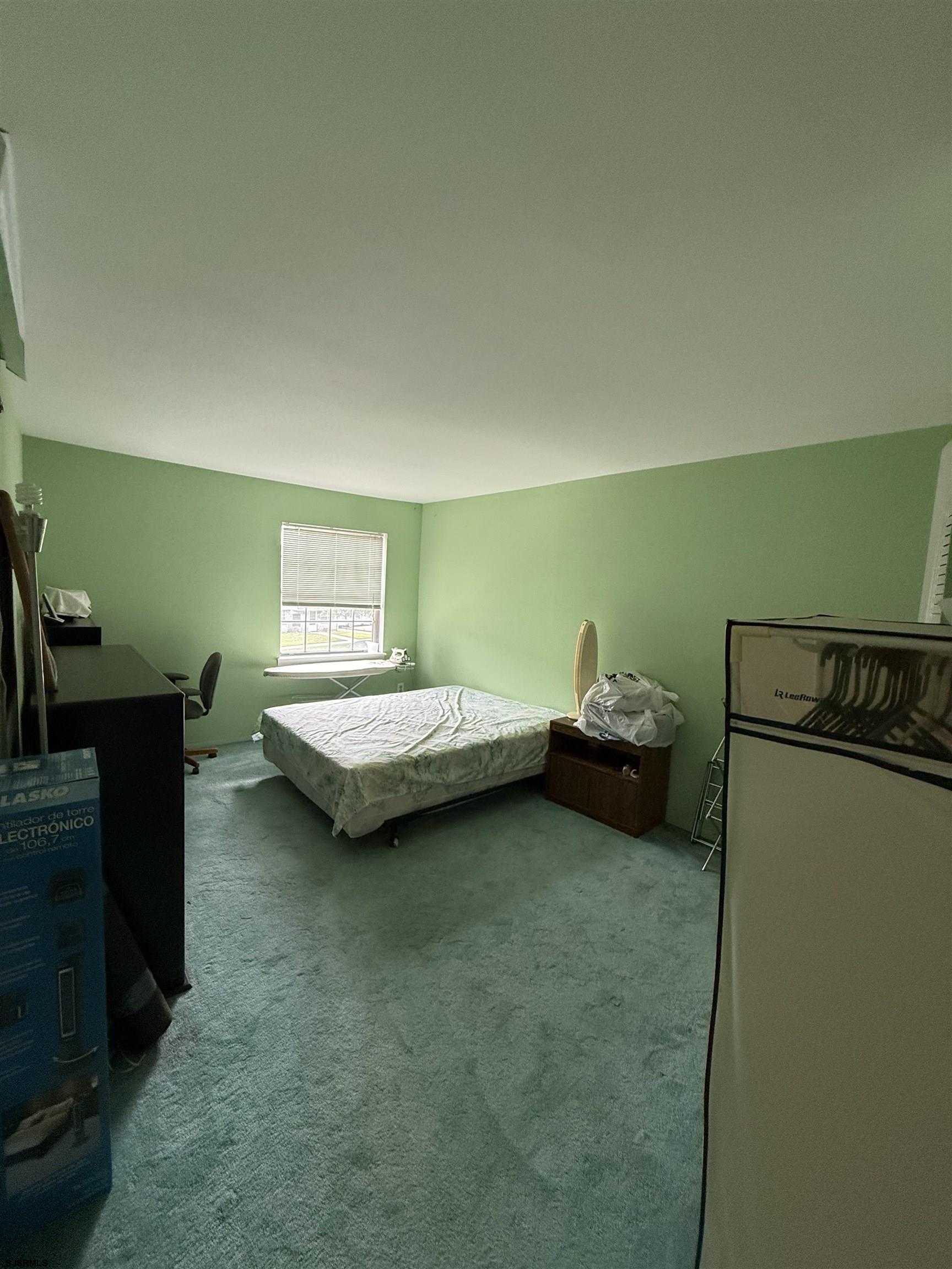 720 South New Road, Unit 5M Absecon, NJ 08201 - Photo 10 of 14 a bedroom with a bed and a dresser