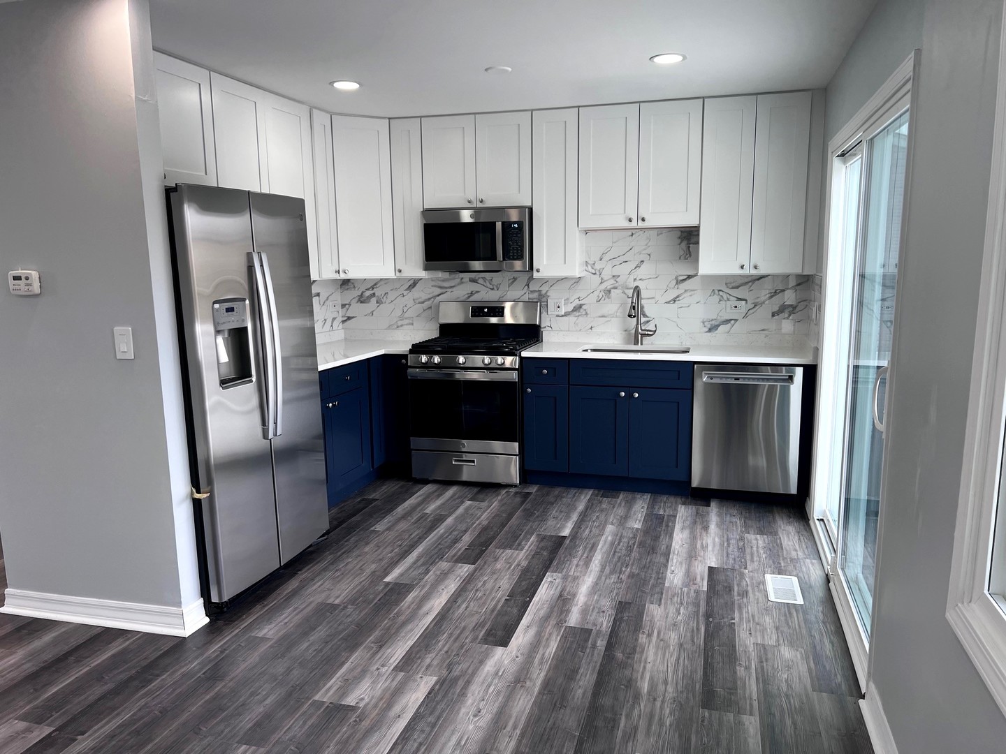1170 Singleton Drive Roselle, IL 60172 - Photo 13 of 42 a kitchen with granite countertop stainless steel appliances and wooden cabinets