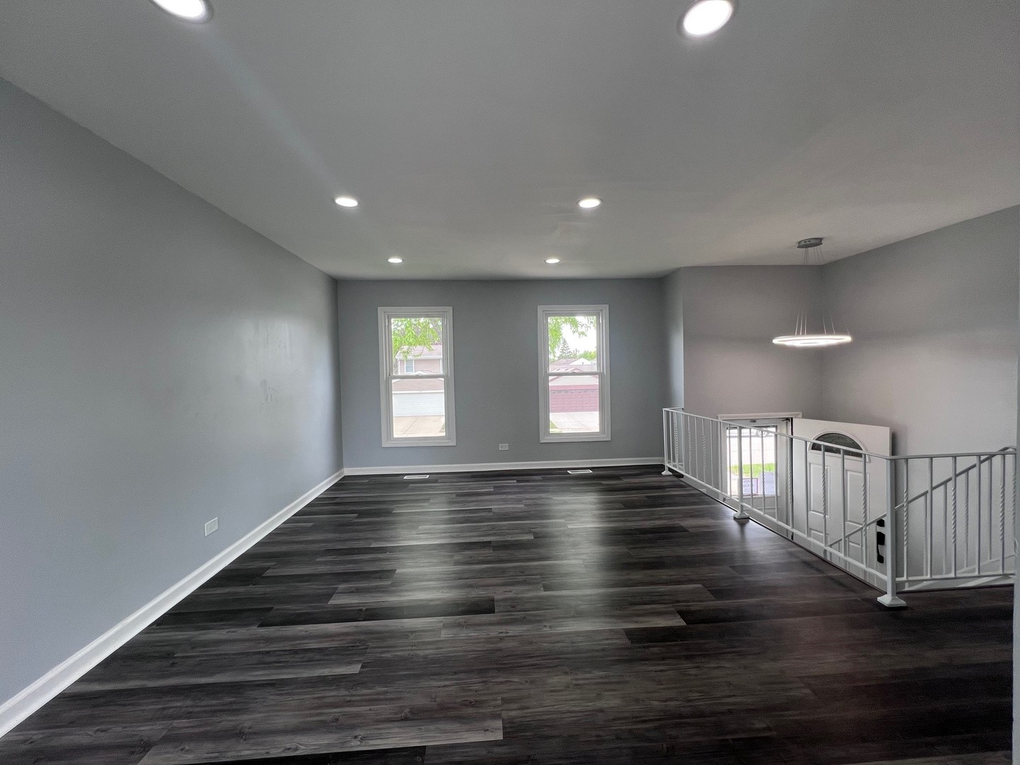 1170 Singleton Drive Roselle, IL 60172 - Photo 17 of 42 a view of an empty room with wooden floor and window