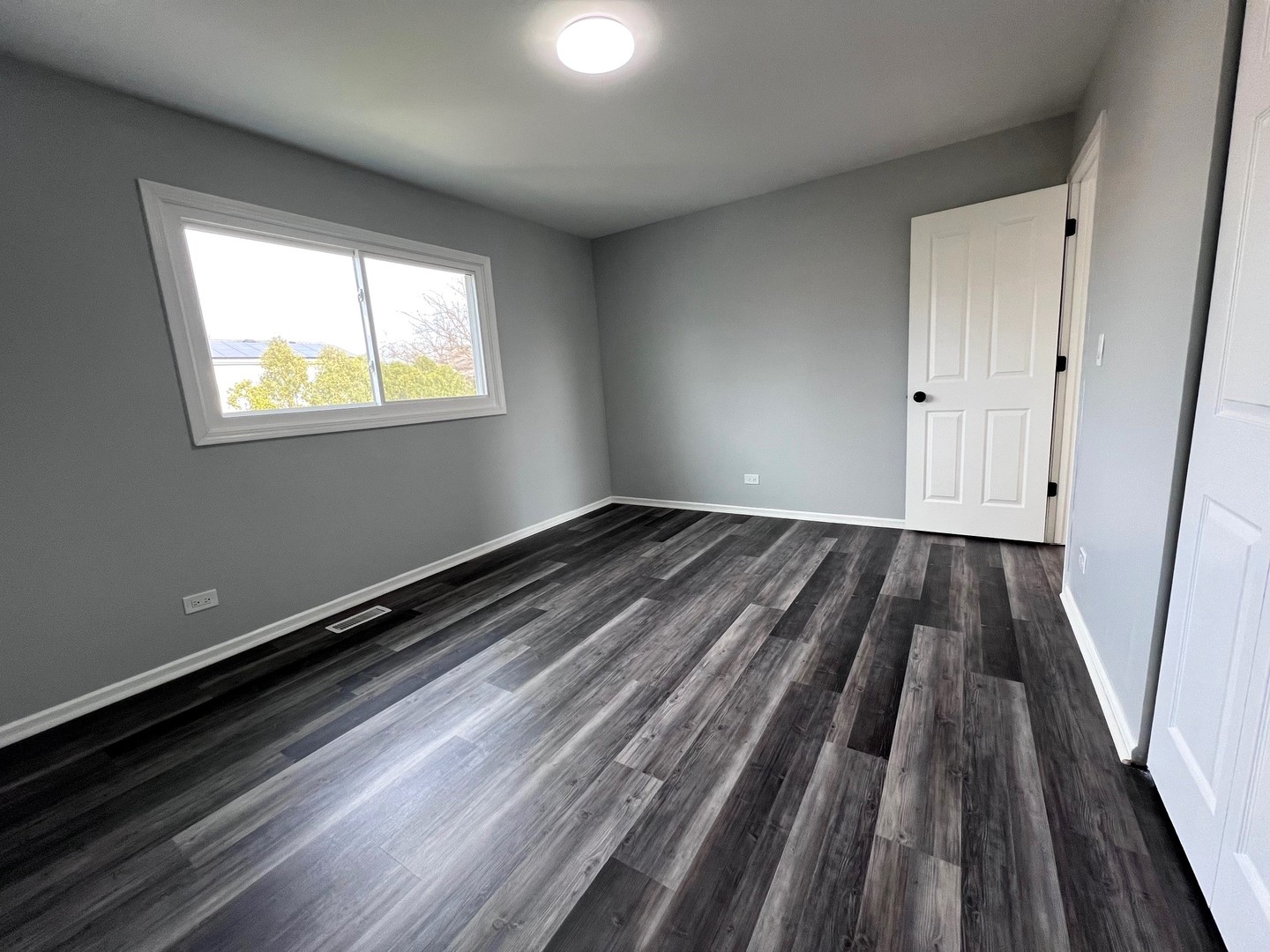 1170 Singleton Drive Roselle, IL 60172 - Photo 23 of 42 a view of wooden floor in an empty room